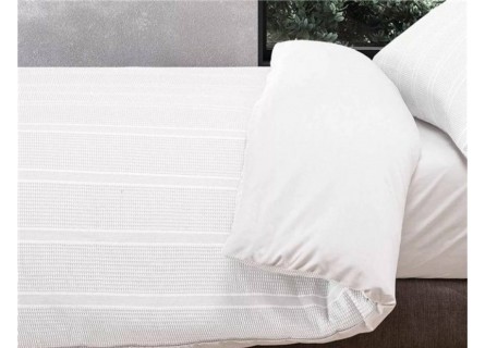 Funda nórdica en blanco con tejido de colcha de la firma Manterol diseño Anbu.