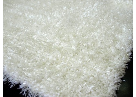 Alfombra de pelo en color liso beige lavable.