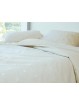 Colcha edredón lisa con detalle de copos de nieve. Diseño original
