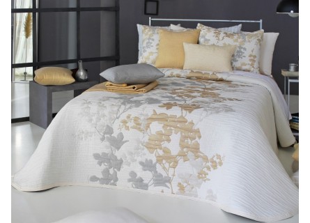 Colcha de Primavera Verano modelo Lyris de Reig Martí en color mostaza oro y gris.