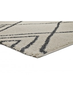 Alfombra con diseño geométrico o étnico en color blanco o beige de pelo largo.