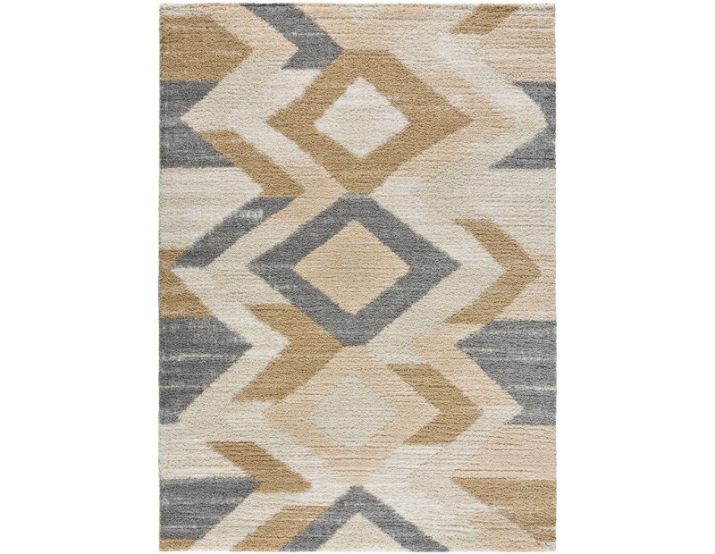 Alfombra estilo étnico en color beige, mostaza, y gris, pelo estilo shaggy.