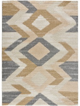 Alfombra estilo étnico en color beige, mostaza, y gris, pelo estilo shaggy.