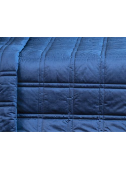 Colcha edredón con tejido aterciopelado en azul.