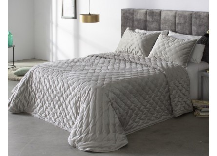 Edredón Pattaya de Reig Marti tejido en terciopelo con bodoque bordado en color gris.