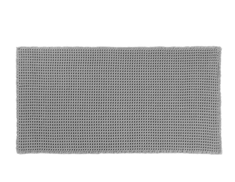 Alfombra de pie de cama de tela antideslizante en tejido de nido de abeja gris.