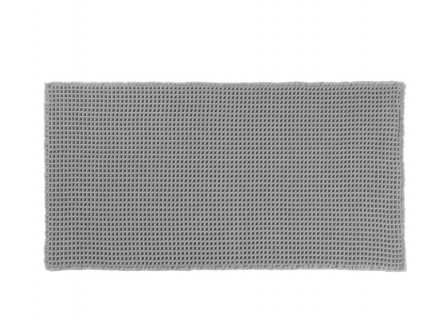 Alfombra de pie de cama de tela antideslizante en tejido de nido de abeja gris.