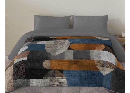 Edredón nórdico Calista estampado con dibujo geométrico en tonos grises, azules, mostazas y negro.